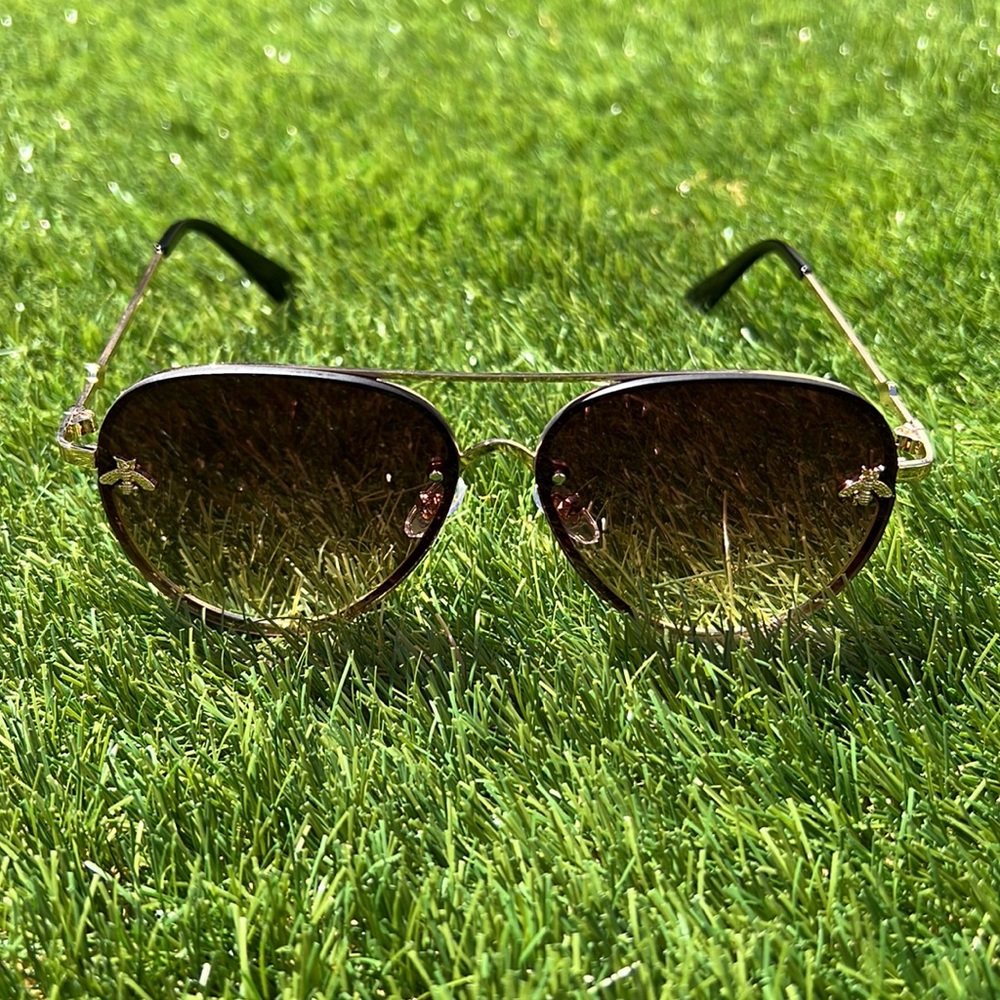 Smoke toned men and women bee emblem sunglasses. UV400  Gold metal frames